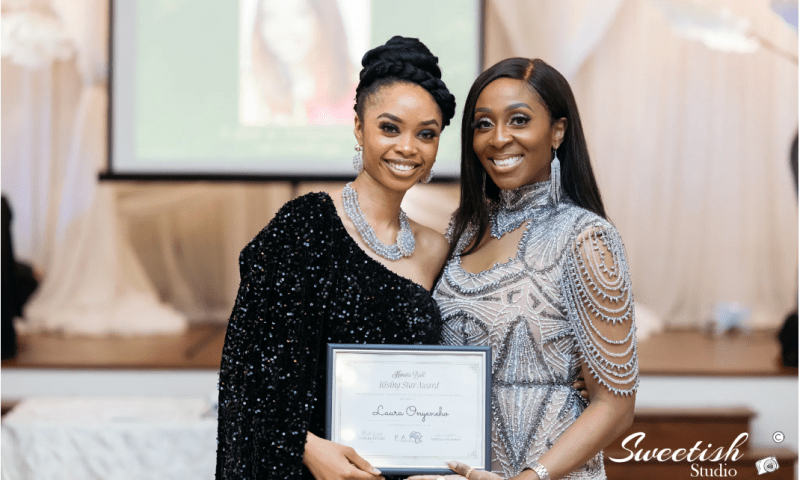 Laura takes photo with PAYA Houston founder